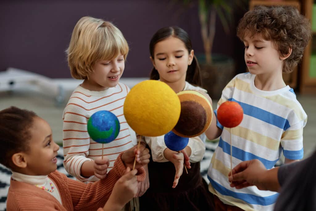 Kids learning about planetary bodies at The Till Academy.