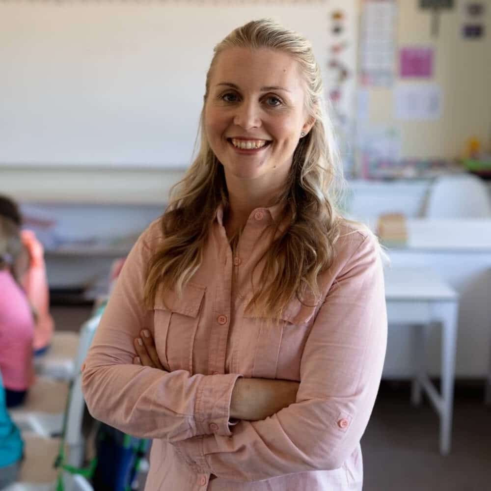 female teacher with long blonde hair standing in a 2023 11 27 04 50 41 utc square.jpg